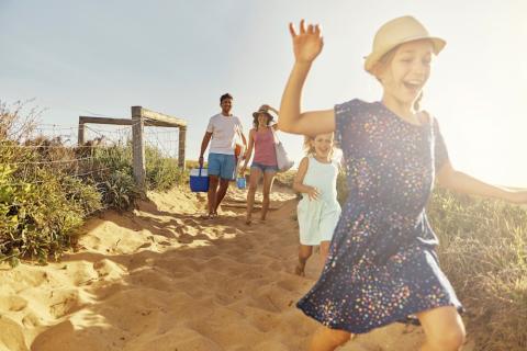 Family running on beach