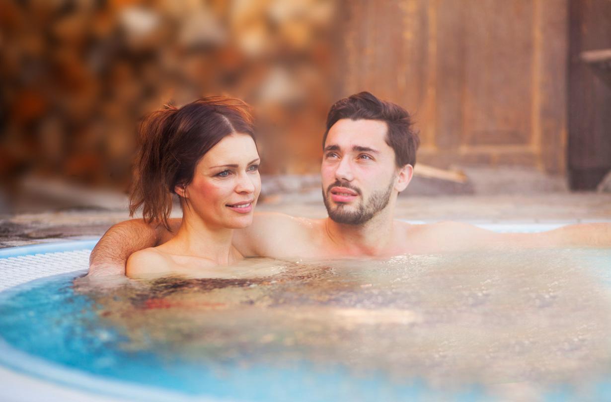 Young couple enjoying a hot tub