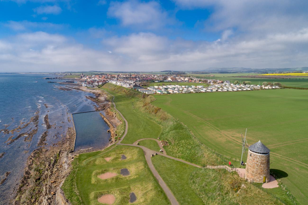 Aerial view of St Monans Holiday Park at Shell Bay on a sunny, summer's day