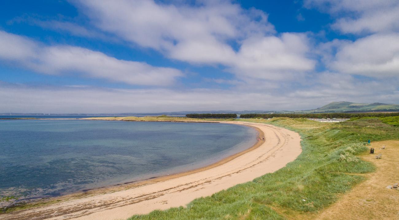 Deserted beach at Shell Bay, Elie Holiday Park on a sunny day