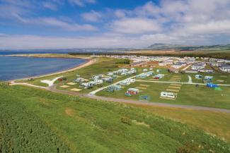 Aerial view of Elie Holiday Park at Shell Bay on a sunny, summer's day