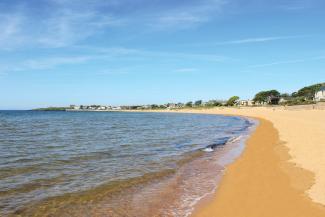 Waves slowly lapping on the sandy beach at Elie and Earlsferry