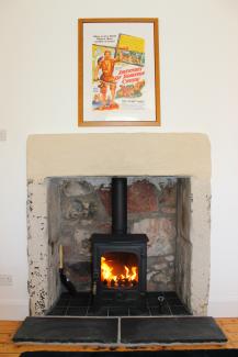 Log fire at 101 Robinson Crusoe' Retreat Cottage