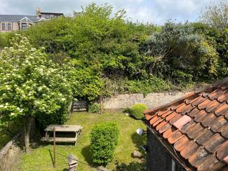 Enclosed rear garden at 103 Robinson Crusoe's Retreat Cottage